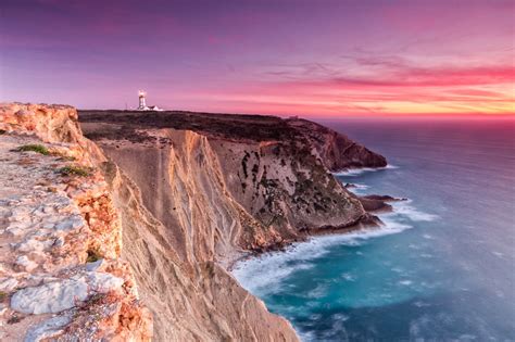 Lighthouse Rocks Cliffs Coast Sea Sky Sunset Evening Nature Landscape