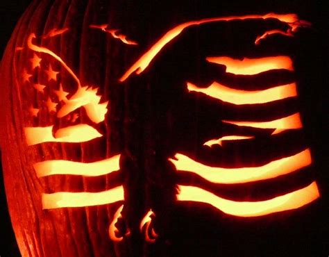 A Carved Pumpkin With An Eagle And The American Flag On Its Side In