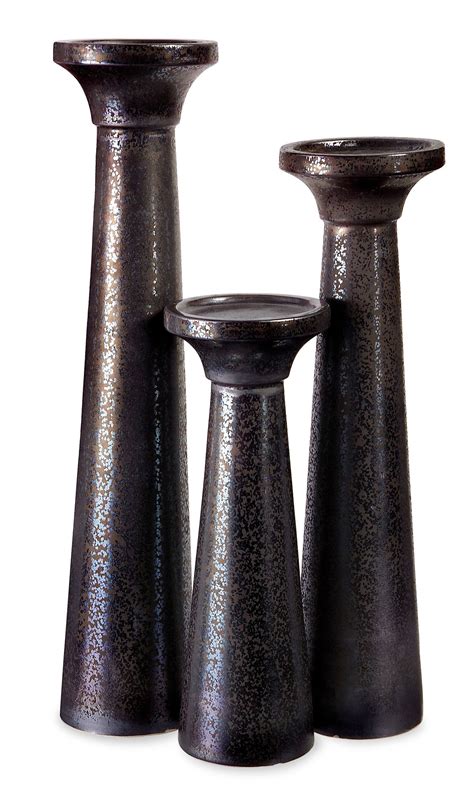 Three Black Vases Sitting Next To Each Other