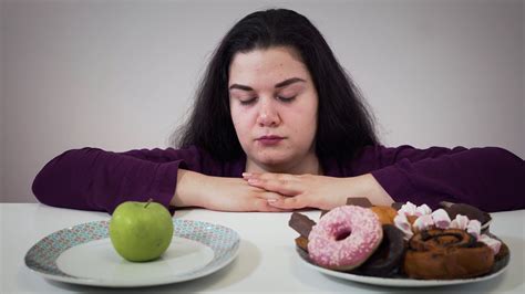 Fat Caucasian Woman Moving Aside Plate With Apple And Taking Unhealthy