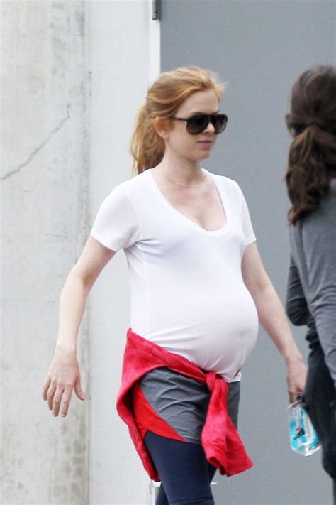 Glowing Isla Fisher Shows Off Huge Baby Bump As She Steps Out With