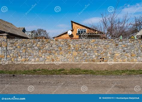 The Stone Fence Is Made Of Decorative Old Large Stones Stock Image