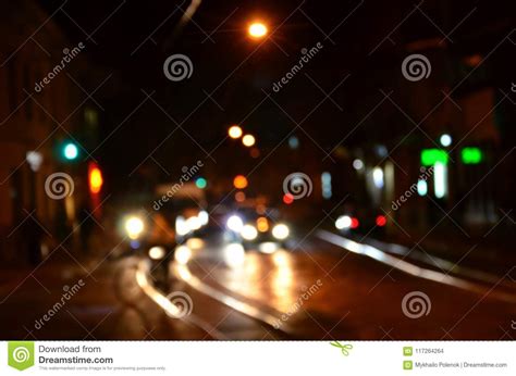 Blurred Night Scene Of Traffic On The Roadway Defocused Image Of Cars