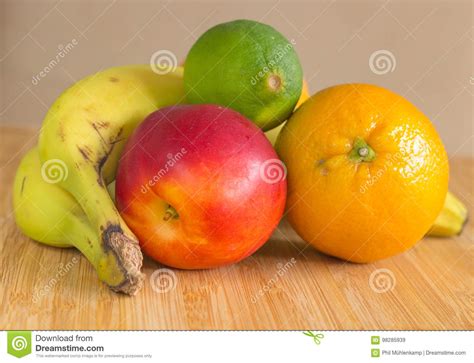 A Group Of Healthy Fruits On A Bamboo Plate Stock Image Image Of