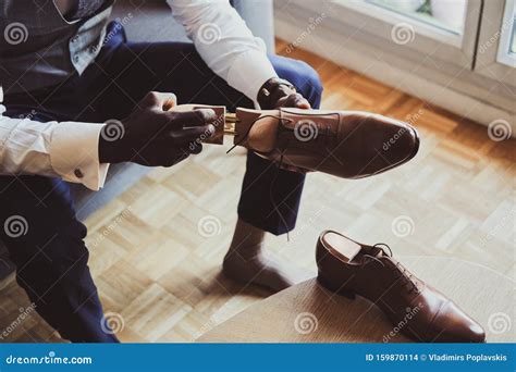 Elegant Man Is Putting On His Shoes Stock Photo Image Of Groom