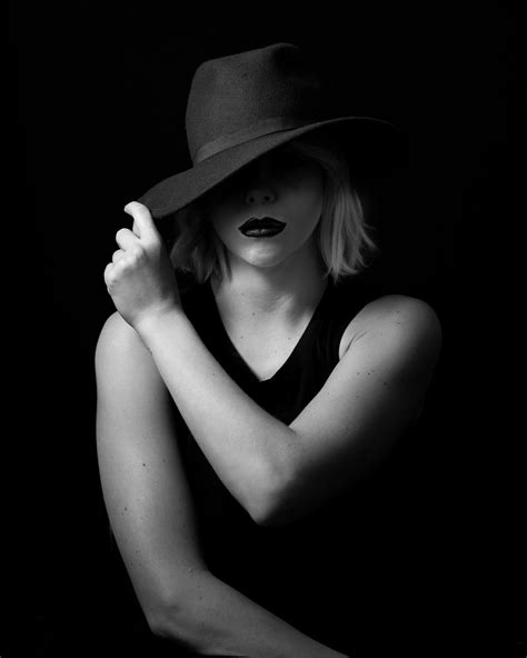 High Contrast Black And White Female Portrait Woman With Hat Face Partially Obscure Black
