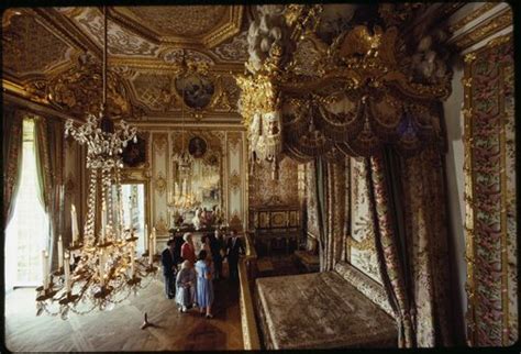 European style luxury carved bedroom set. Tourists visit Marie Antoinette's bedroom in the ...