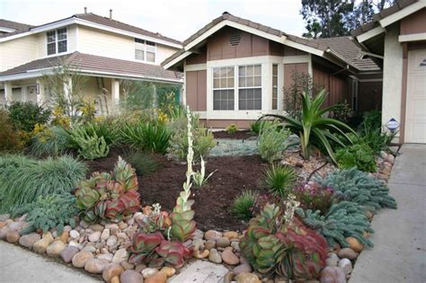 Drought Resistant Front Yard Using Rocks Bark And Plantsshrubs That