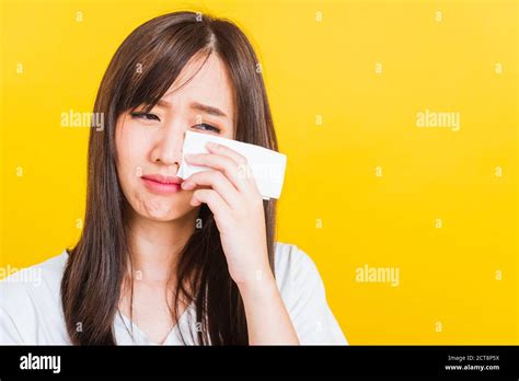 Portrait Of Asian Beautiful Young Woman Sad She Crying Wiping Tears From Eyes With A Tissue