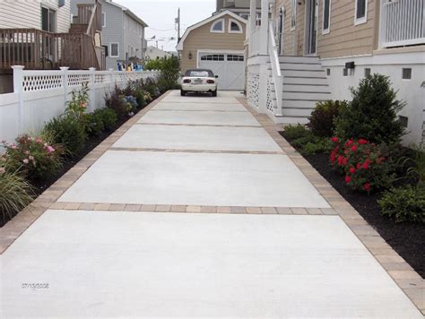 Like Concrete And Paver Driveway Or Concrete With Stamped Edge Instead
