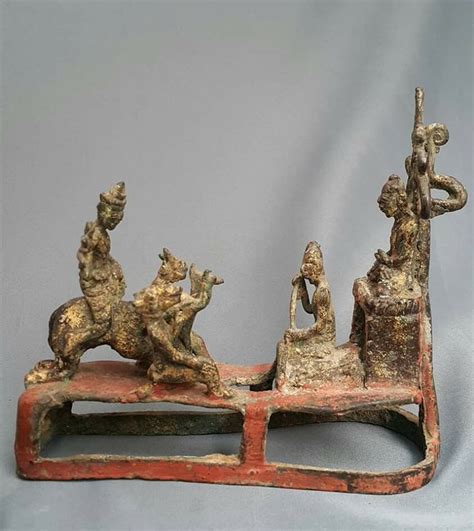 burmese bronze miniature depicting the attack of mara buddha is under the tree and protected by