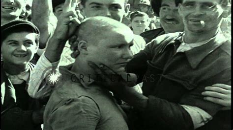A Woman Collaborator With Shaved Head Marched After The Liberation Of