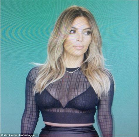 she s loving her new form kim kardashian showed off her trim post pregnancy middle in a sheer