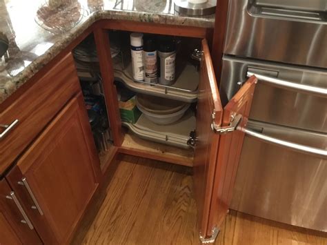 Whether placed in your base cabinets or above your refrigerator or wall oven, tray dividers add value to underutilized kitchen areas. Corner base cabinet solution: pullout shelves, hinged ...