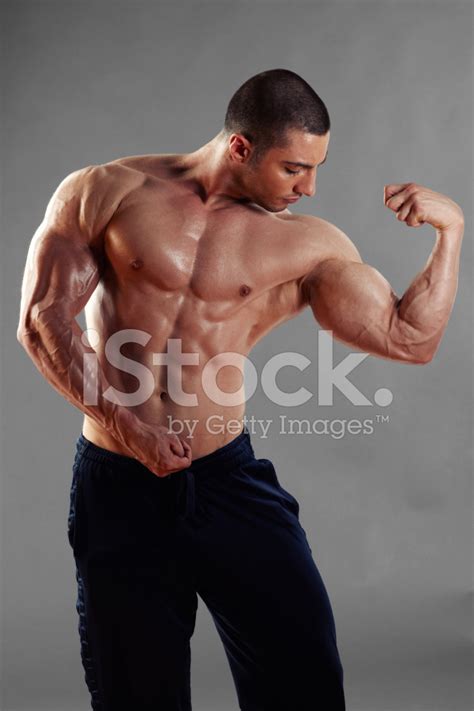 Muscular Man Standing And Flexing Biceps Stock Photo Royalty Free