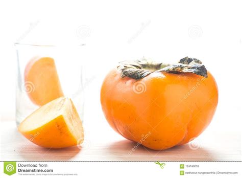 Persimmon On A White Background Persimmon Orange In Front View Stock