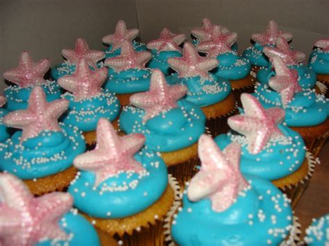 Gold Cupcake With Buttercream Frosting And White Chocolate Starfish