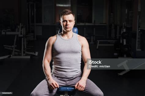 Strong Handsome Fit Man Exercising In The Gym Personal Trainer Workout