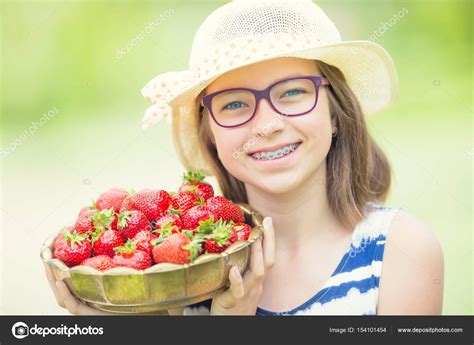 Cute Little Girl With Bowl Full Of Fresh Strawberries Pre Teen Girl