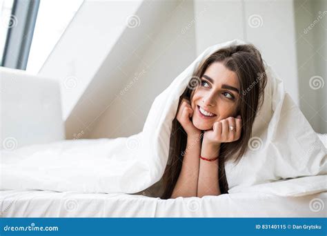 Woman Under A Duvet In Her Bedroom Stock Image Image Of Blond