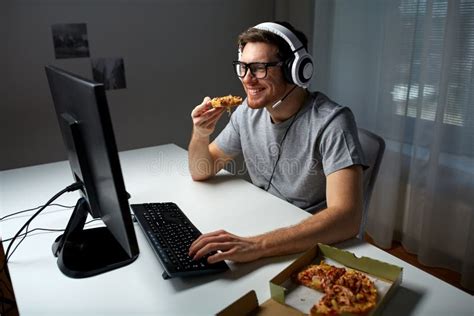 Man In Headset Playing Computer Video Game At Home Stock Photo Image