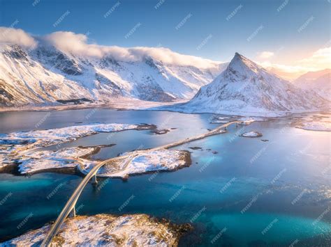 Premium Photo Aerial View Of Bridge Over The Sea And Snowy Mountains