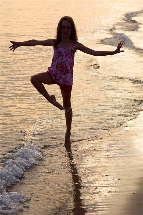 Happy Girl Dancing On The Beach At The Sunset Time Stock Image Image Of Laughing Active 75551851