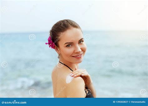 Woman Applying Sunscreen Creme On Tanned Shoulder Skincare Body Sun Protection Sun Cream