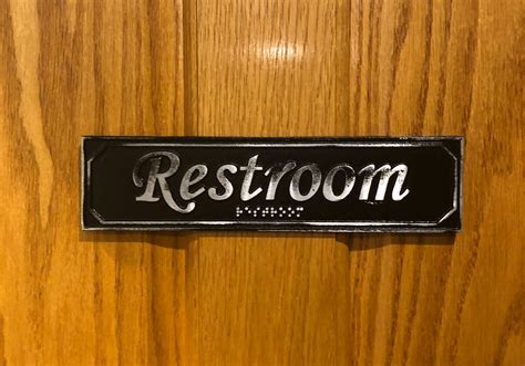 Antiqued Restroom Door Sign With Braille Custom Metal Signs