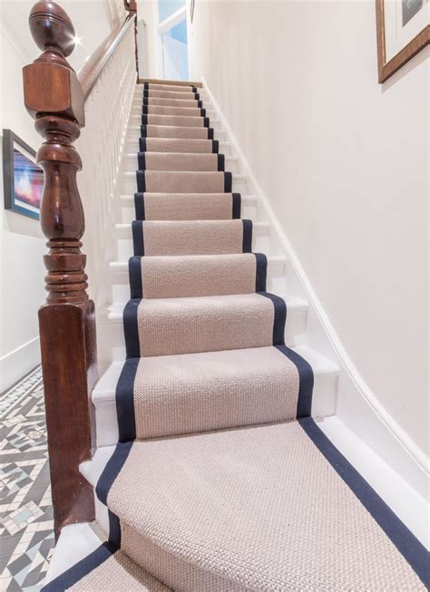 There Is A Staircase With Blue And White Carpet