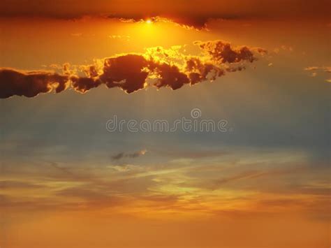Cloudy Sunset And Sun Beam On Blue Pink Sky Yellow Clouds Skyline