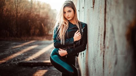 white hair girl model is wearing black jacket and pant standing in blur background hd girls