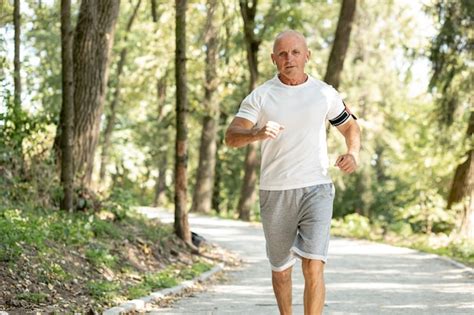 Old Man Running In The Woods Photo Free Download