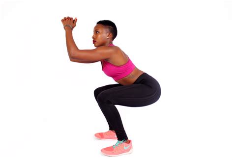 Fitness Woman Doing Air Squats On White Background