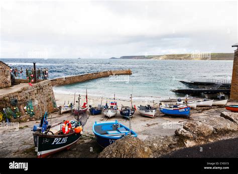 Fishing Boats On Dry Land In Sennen Cove Cornwall Moored Up In