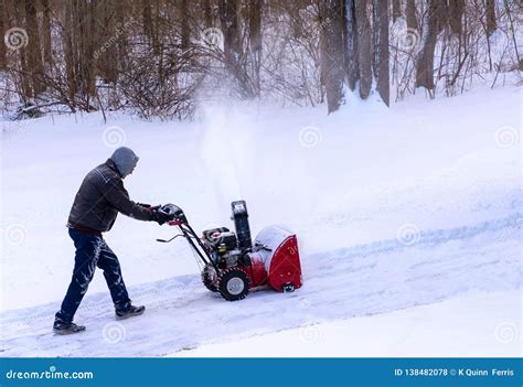 Clearing Snow From A Drivway Using Snowblower Stock Photo Image Of