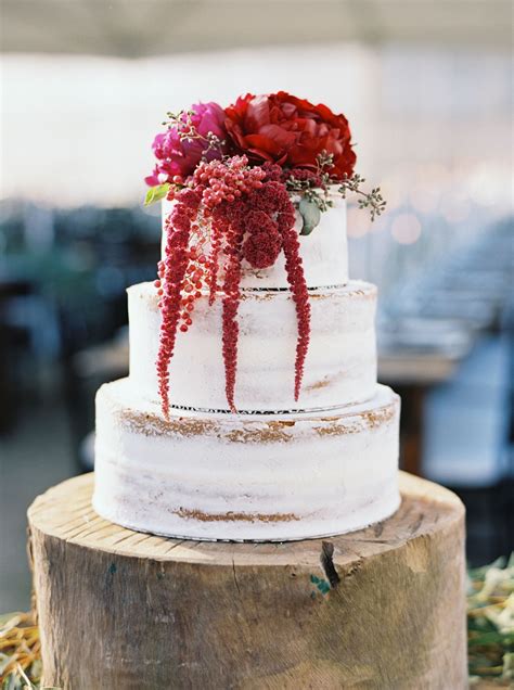 Rustic Rough Frosted Wedding Cake With Crimson Flowers