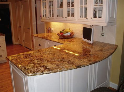 Brown granites are ideal for rustic kitchen decors when you have white cabinets and stainless steel appliances. Choosing the Right Types of Kitchen Countertops - Amaza Design