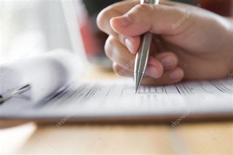 Human Hand With Pen Stock Photo By ©jannystockphoto 89726272