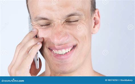 Portrait Of Cheerful Handsome Shirtless Man Talking On The Phone Stock