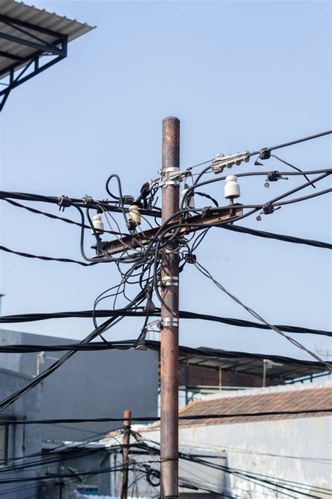 Messy Electricity Wires On The Pole Pole With A Large Number And
