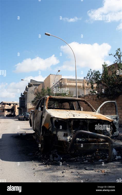 Burnt Car In Sirte Street Stock Photo Alamy