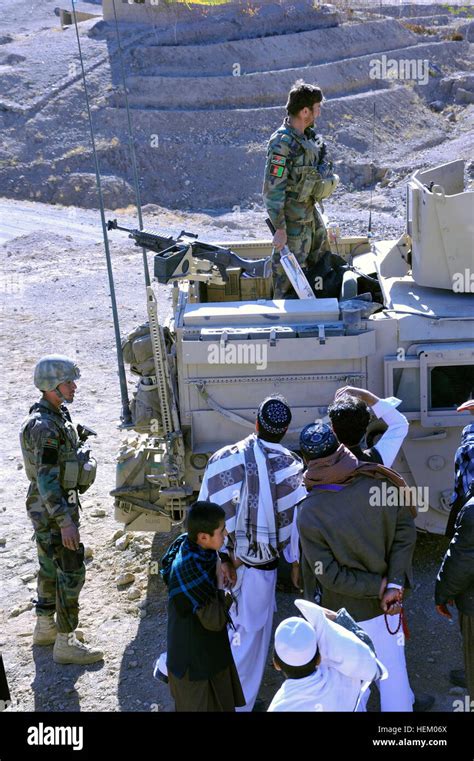 Boys And Young Men Gather Around Afghan National Army Special Forces To