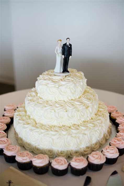 Ivory Wedding Cake And Mini Cupcakes