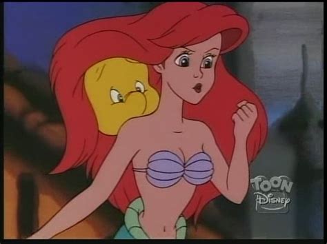 Ariel From The Babe Mermaid With Her Hair Blowing In The Wind And Looking At Something