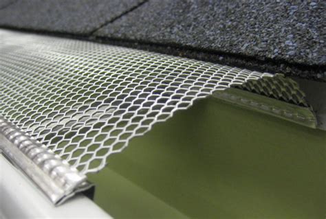 Mesh Gutter Guards Are Sheets Filled With Holes That Cover The Gutter