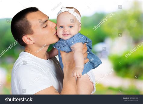 Happy Young Man Holding Baby Stock Photo 1276533100 Shutterstock