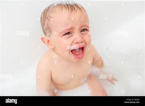 Crying Baby By In A Bathtub Infant Kid Sreaming While Taking A Bath