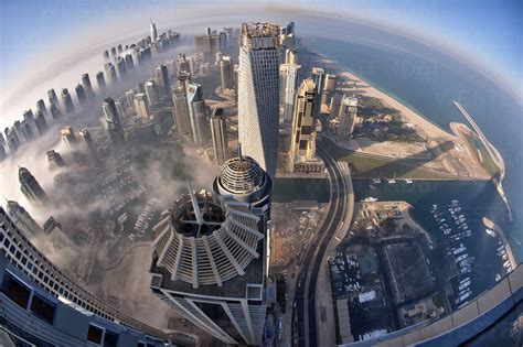 Aerial View Of Cityscape With Skyscrapers Above The Clouds In Dubai