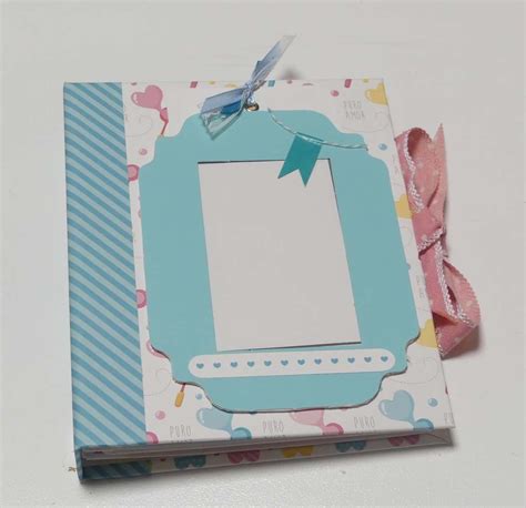 A Blue And White Photo Album With A Bow On It